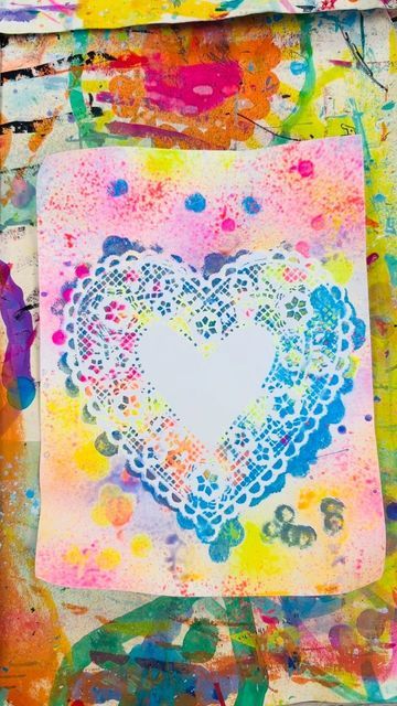 This may contain: a painting with lots of different colors and shapes on it's surface, including the shape of a heart