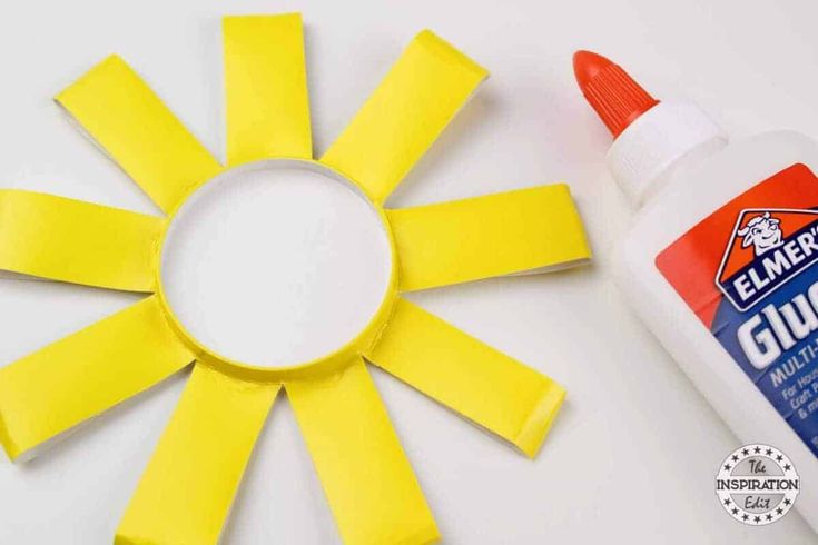 This may contain: the glue is taped around the yellow flower