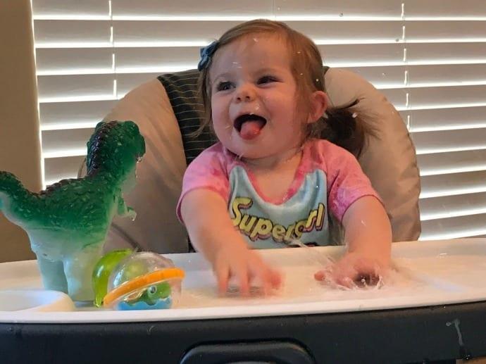 Make a mini water table out of your high chair and other water play ideas for babies