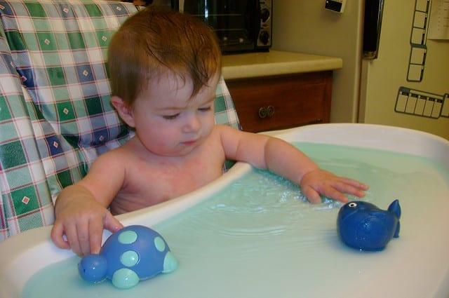 Maddy in her baby water table