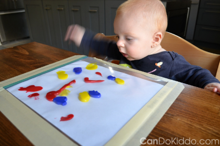 A baby playing with a puzzle

Description automatically generated with low confidence