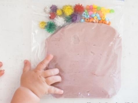 Sensory Activities for Babies: Let your baby explore play dough safely with a Play Dough Sensory Bag!