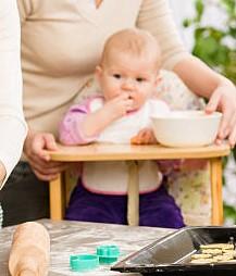 A baby sitting at a table

Description automatically generated with medium confidence