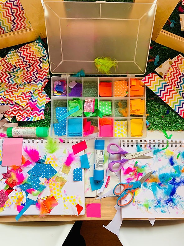 Art idea for kids. Rainbow coloured paper in an organiser box for collage