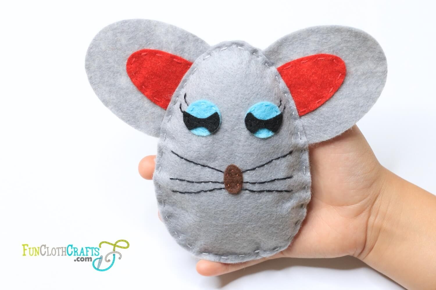 free felt mouse pattern, grey felt mouse softie on hand with red ears inspired by a drawing