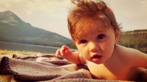 allowing a baby to explore nature while at the beach