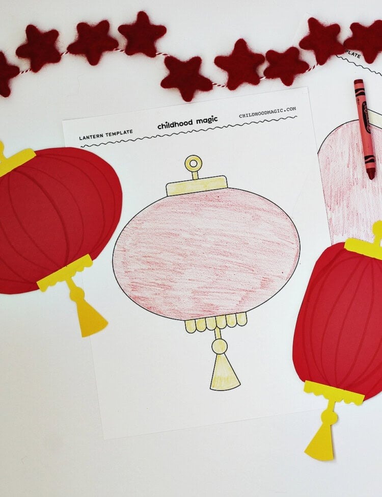 Red and yellow cardstock cut and glued to make paper lanterns. Next to them are lantern coloring pages and a red star garland.