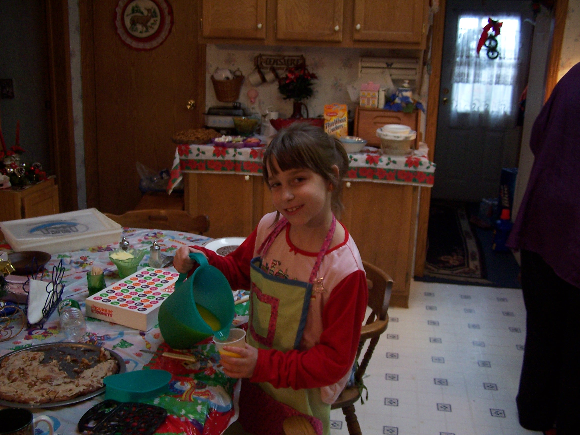 Mayflower boat craft for kids from Fantastic Fun and Learning - two children watching boat they built that looks like the Mayflower float in a kiddie pool in front yard