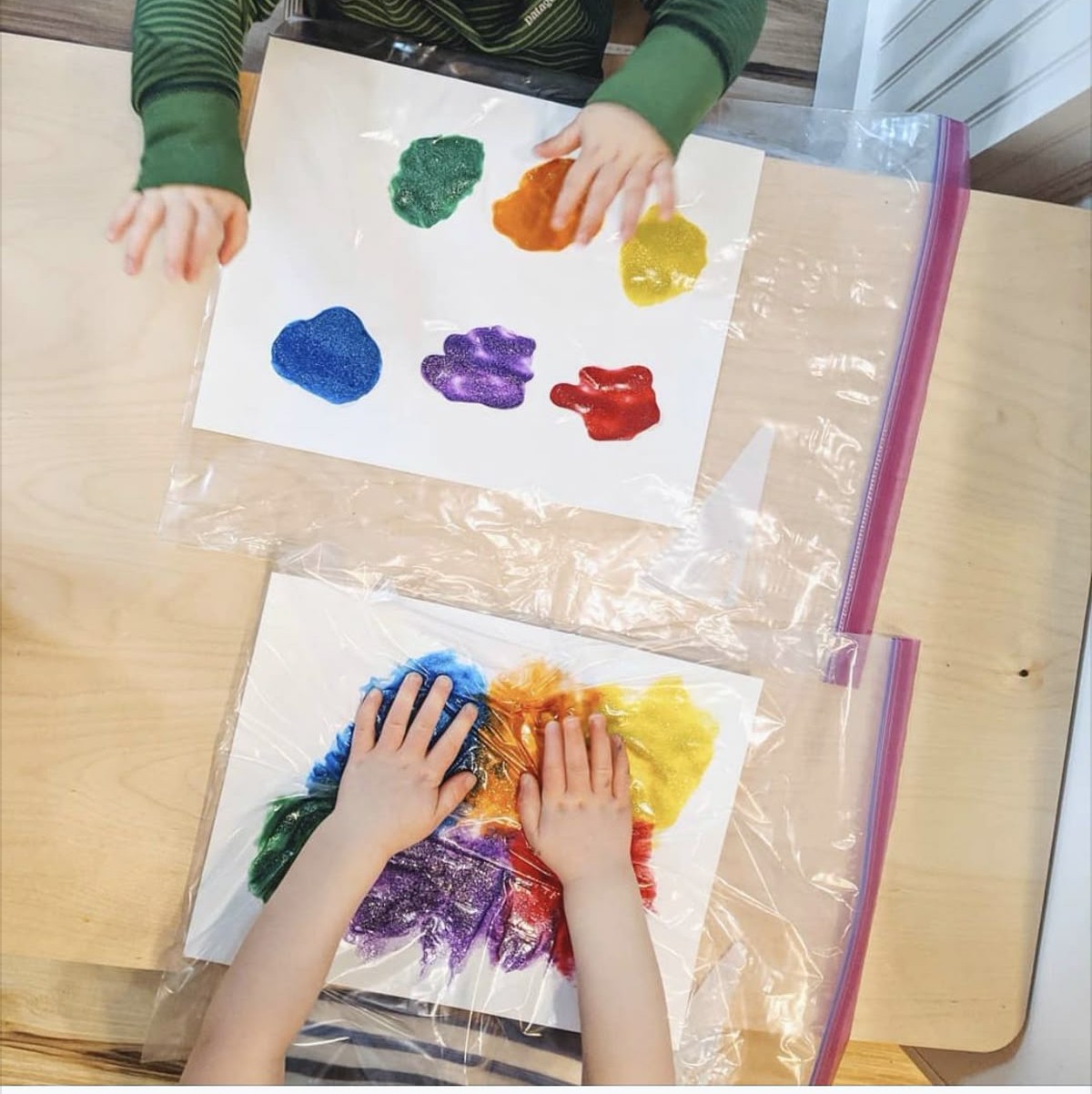 This may contain: a child is painting in a bag with the words mess free on it and an image of