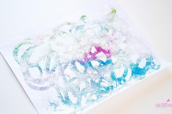 Do you love glitter? This glitter printing project is a fun process art activity for kids (and adults too!) Tips on how NOT to make a mess with glitter too.