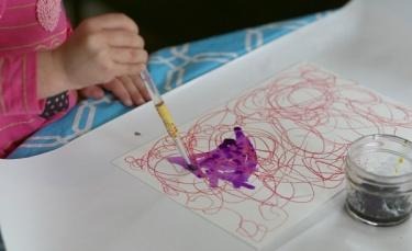 Painting over oil pastels with watercolors